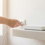 A digital nomad working on a laptop on a scenic Mediterranean balcony during golden hour.